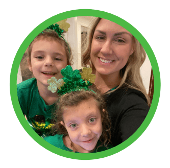 Image of the author, Stephanie McBurnett, and her two children in St. Patrick's Day attire.
