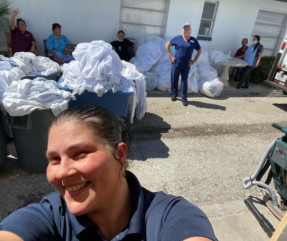 HCSG team members removing linens after Hurricane Ian.