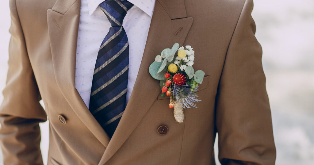 Groom in tan suit