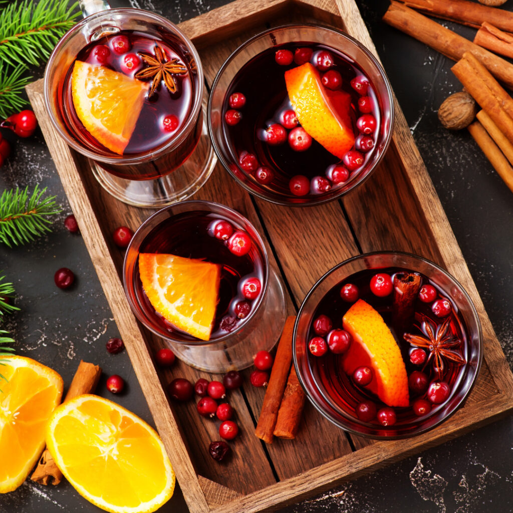 To sweeten holiday beverages, avoid refined sugar by using cinnamon, cranberries, or orange slices. These ingredients infuse your drinks with natural sweetness and festive flavors.