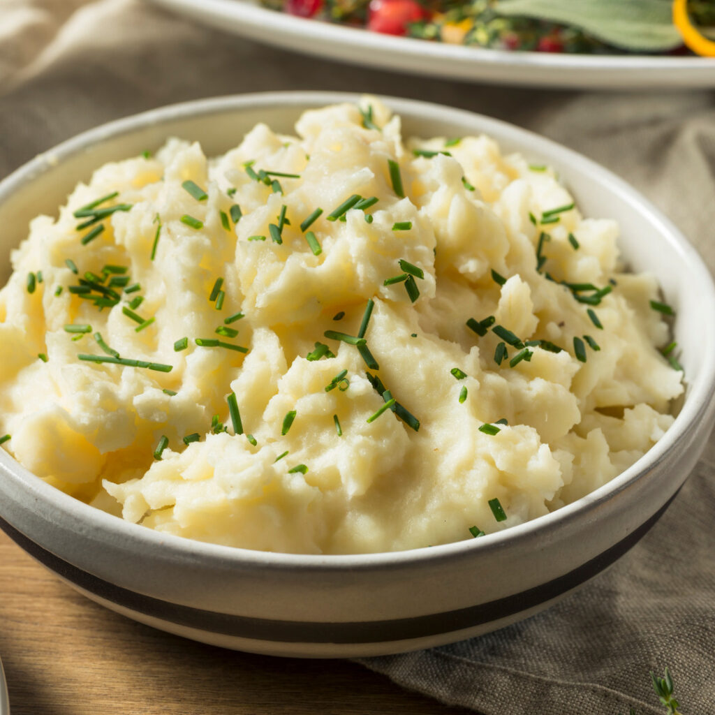 Replace butter and cream in mashed potatoes with low-sodium chicken or vegetable broth. This swap maintains a creamy texture while significantly reducing the fat content.